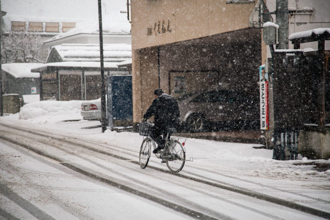 Man on bicycle in snowy Japan | Vikash Autar Television Program Film Director Hong Kong and Sydney