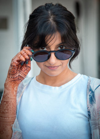 Pakistani girl with henna lowers sunglasses | Vikash Autar Television Program Film Director Hong Kong and Sydney